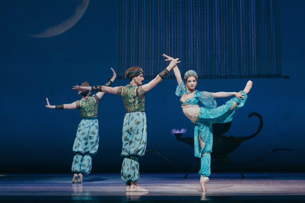 arabian princess en point arabesque w her attendants behind her