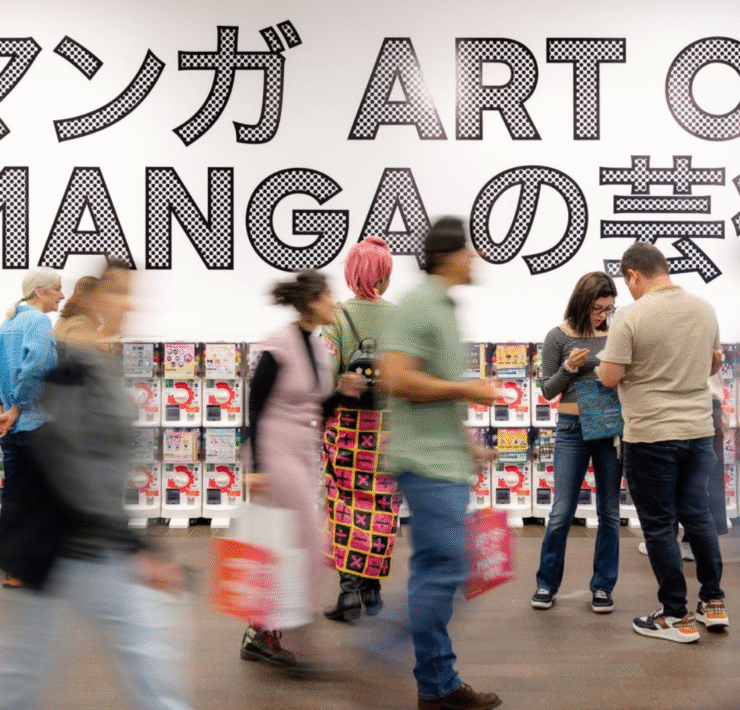 motion blue of the crowd walking past the toy machines