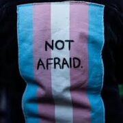 a trans flag with the words "Not Afraid" written in the middle